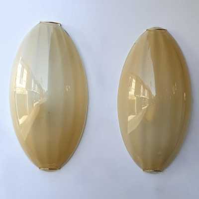 Yellow Murano glass wall sconces, Space Age style, Mid-Century Modern style, gold leaf and brass. Renowned manufacturers and designers: Barovier Toso, Fabbian, Venini, Veronese, La Murrina, Aldo Carlo Nason, Stilnovo, Joe Colombo, Arteluce, Arredoluce, Lumi, Luci, Rggiani, Sciolari, Werner Pantone, Luigi Colani, Raak, Angelo Lelii, Angelo Brotto, Esperia, Francesco Bocola, Superstudio, Enrico Tronconi, Mario Bellini, Harvey Guzzini, Luigi Massoni, Martinelli, Pierre Cardin, Fabio Lenci and Gio Po
