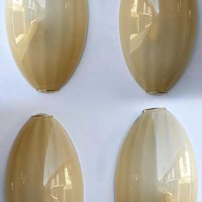 Yellow Murano glass wall sconces, Space Age style, Mid-Century Modern style, gold leaf and brass. Renowned manufacturers and designers: Barovier Toso, Fabbian, Venini, Veronese, La Murrina, Aldo Carlo Nason, Stilnovo, Joe Colombo, Arteluce, Arredoluce, Lumi, Luci, Rggiani, Sciolari, Werner Pantone, Luigi Colani, Raak, Angelo Lelii, Angelo Brotto, Esperia, Francesco Bocola, Superstudio, Enrico Tronconi, Mario Bellini, Harvey Guzzini, Luigi Massoni, Martinelli, Pierre Cardin, Fabio Lenci and Gio Po