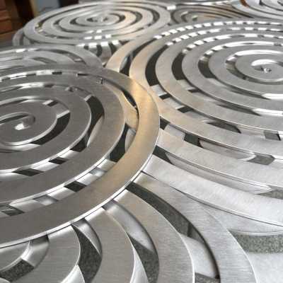 Large, contemporary spiral stainless steel coffee table by Italian artist-designer Antonio Cagianelli. Handcrafted, signed and dated 2024 with the AC monogram. Limited edition of eight. Some of Antonio Cagianelli's works are housed at the Musée des Arts Décoratifs in Paris.