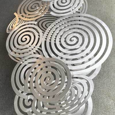 Large, contemporary spiral stainless steel coffee table by Italian artist-designer Antonio Cagianelli. Handcrafted, signed and dated 2024 with the AC monogram. Limited edition of eight. Some of Antonio Cagianelli's works are housed at the Musée des Arts Décoratifs in Paris.