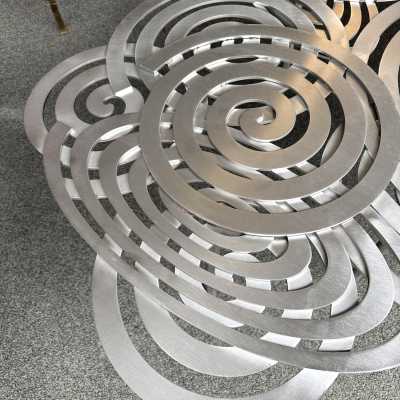 Large, contemporary spiral stainless steel coffee table by Italian artist-designer Antonio Cagianelli. Handcrafted, signed and dated 2024 with the AC monogram. Limited edition of eight. Some of Antonio Cagianelli's works are housed at the Musée des Arts Décoratifs in Paris.