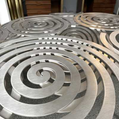 Large, contemporary spiral stainless steel coffee table by Italian artist-designer Antonio Cagianelli. Handcrafted, signed and dated 2024 with the AC monogram. Limited edition of eight. Some of Antonio Cagianelli's works are housed at the Musée des Arts Décoratifs in Paris.