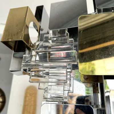Space Age-style pendant chandelier, Mid-Century Modern design, designed by Italian designer Gaetano Sciolari for one of his editors, Stilkronen. Chrome-plated metal, brass, and glass. Famous designs: Reggiani, Stilux, and Esperia.