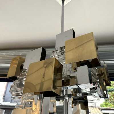 Space Age-style pendant chandelier, Mid-Century Modern design, designed by Italian designer Gaetano Sciolari for one of his editors, Stilkronen. Chrome-plated metal, brass, and glass. Famous designs: Reggiani, Stilux, and Esperia.