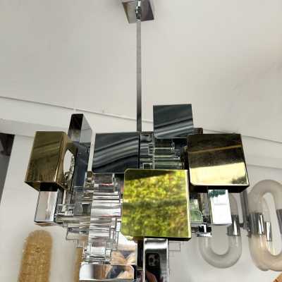 Space Age-style pendant chandelier, Mid-Century Modern design, designed by Italian designer Gaetano Sciolari for one of his editors, Stilkronen. Chrome-plated metal, brass, and glass. Famous designs: Reggiani, Stilux, and Esperia.
