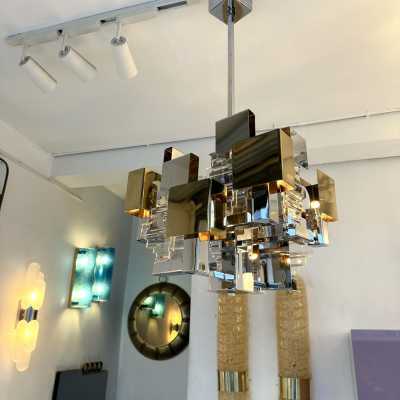 Space Age-style pendant chandelier, Mid-Century Modern design, designed by Italian designer Gaetano Sciolari for one of his editors, Stilkronen. Chrome-plated metal, brass, and glass. Famous designs: Reggiani, Stilux, and Esperia.