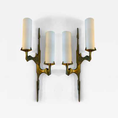 Pair or set of two Mid-Century Modern wall sconces by Maison Arlus. Cast gilt bronze and opaline glass. Rare model, beautiful patina. Original documentation available upon request. Renowned manufacturers such as Stilnovo, Arteluce, Arredoluce, Maison Jansen, Charles, Hollywood Regency, and Felix Agostini.