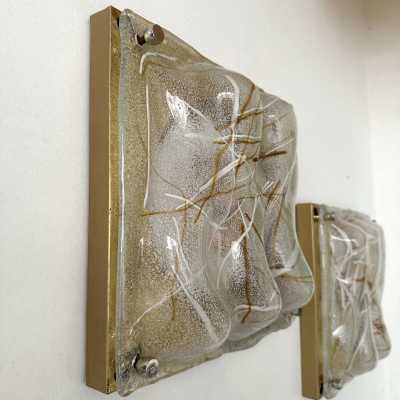 Pair of Space Age, Mid-Century Modern style wall lights, in textured Murano glass and brass, with gold brushed brass finish to the sides. Can also be recessed. Renowned Italian design: Venini, Vistosi, La Murrina, Aldo Carlo Nason for Mazzega, Stilnovo, Joe Colombo, Arteluce, Arredoluce, Lumi, Luci, Rggiani, Sciolari, Werner Pantone, Luigi Colani, Raak, Angelo Lelii, Angelo Brotto, Esperia, Francesco Bocola, Superstudio, Enrico Tronconi, Mario Bellini, Harvey Guzzini, Luigi My