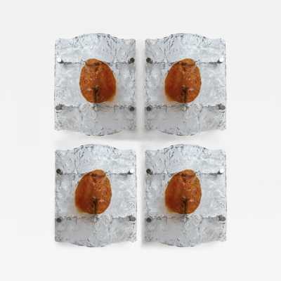 Pair of mid-century space age wall sconces in amber and clear textured Murano glass and metal backplate by Toni Zuccheri for Mazzega Manufacture. Famous Italian design like Venini, Vistosi, La Murrina, Aldo Nason, Stilnovo, Joe Colombo, Arteluce, Arredoluce, Lumi, Luci, Rggiani, Sciolari, Werner Pantone, Luigi Colani, Raak, Angelo Lelii, Angelo Brotto, Esperia, Francesco Bocola, Superstudio, Enrico Tronconi, Mario Bellini, Harvey Guzzini, Luigi Massoni, Martinelli, Pierre Cardin