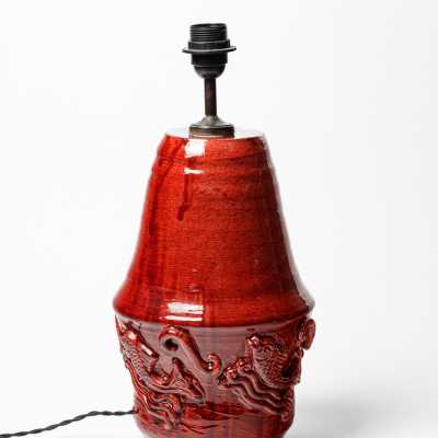 Red glazed ceramic table lamp by Jean Austruy, circa 1960.