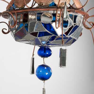 Detail of the Dubreuil and Dixon chandelier: blue and red glass bowl, led mirrors, blue spheres