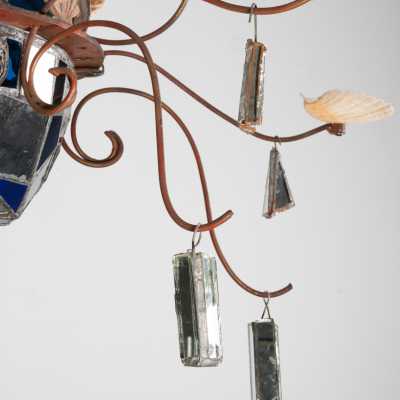 Detail of the Dubreuil and Dixon chandelier: mirrored pendants suspended from wrought iron arms