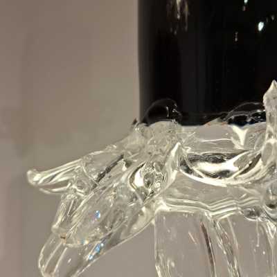 Detail of a Murano pendant light in black glass ending in clear crystal leaves, circa 1960