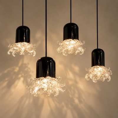 Set of 4 Murano pendant lights in black glass and clear crystal, circa 1960, with shadows cast on the wall